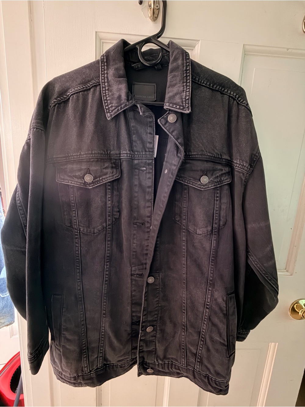 American Eagle Outfitters Black women’s denim jacket.